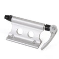 Silver metal quick release fixing clamp for mounting accessories on a bicycle front fork.