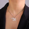 Stainless steel necklace with cross chain design and a pendant, available in gold or steel colour.