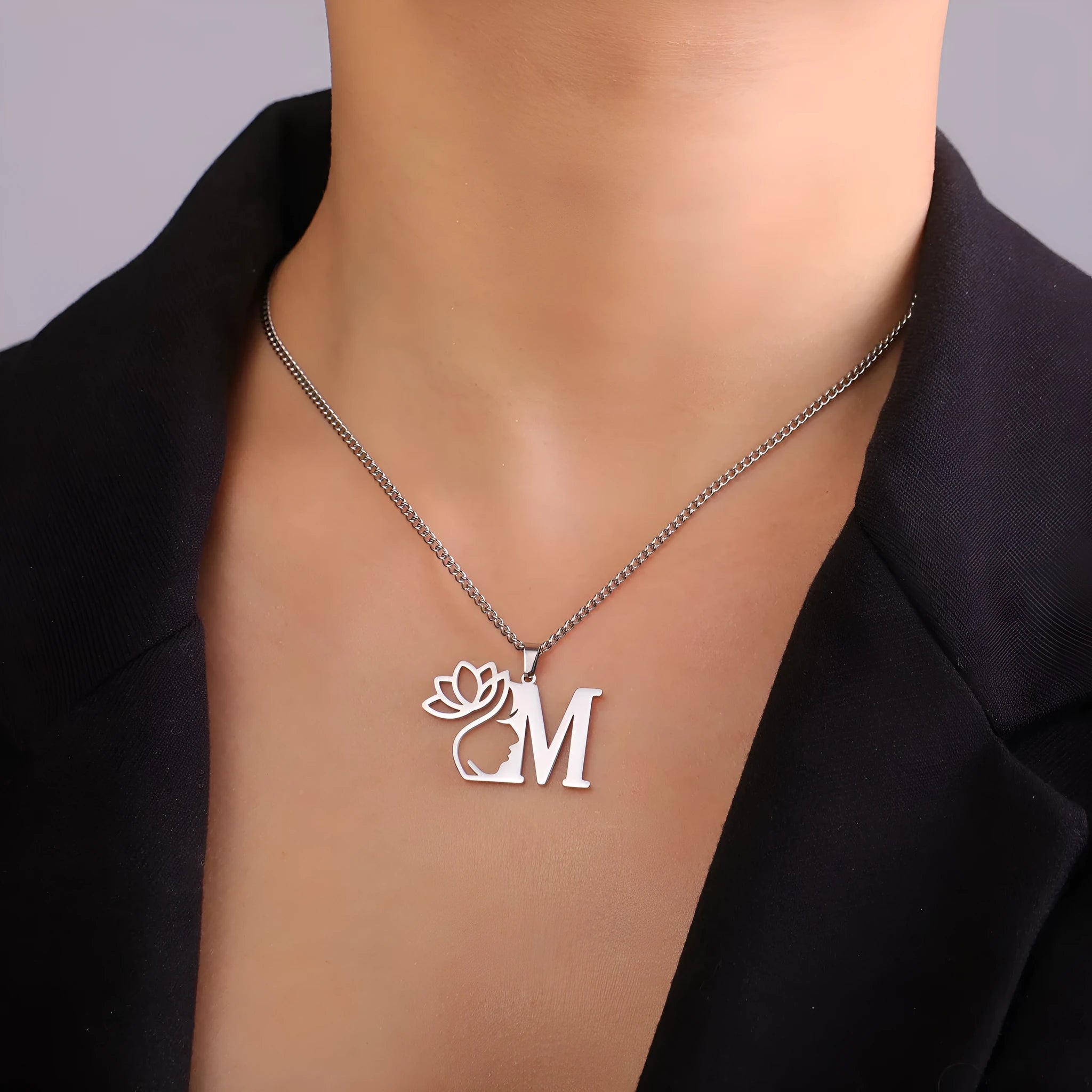 Stainless steel necklace with cross chain design and a pendant, available in gold or steel colour.