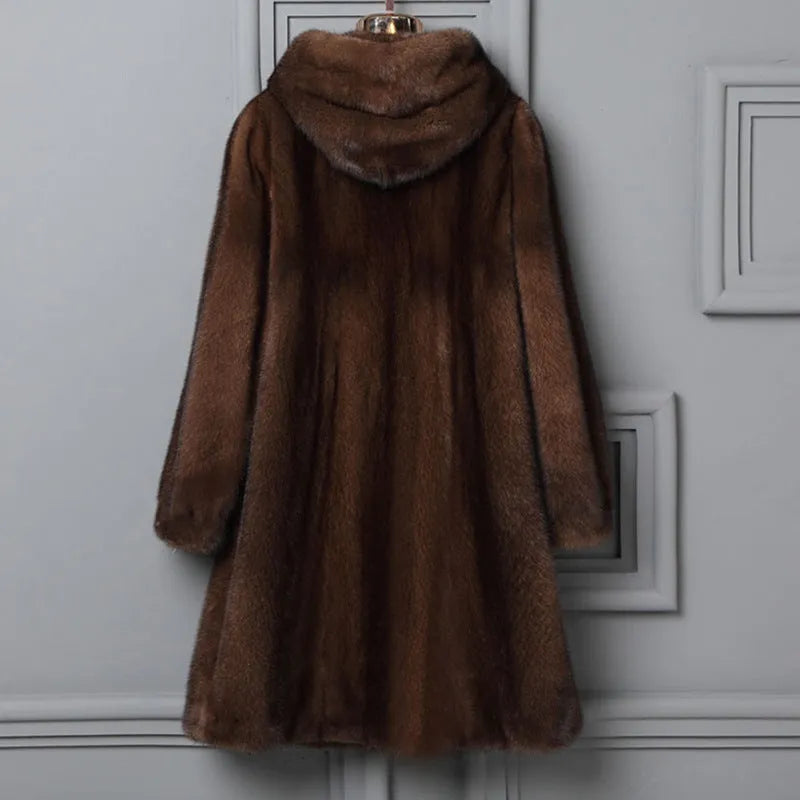 Women's long black faux fur hooded coat for winter street fashion wear.