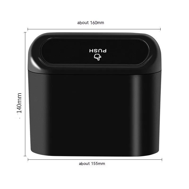 Black folding plastic car trash can shown in a vehicle footwell.