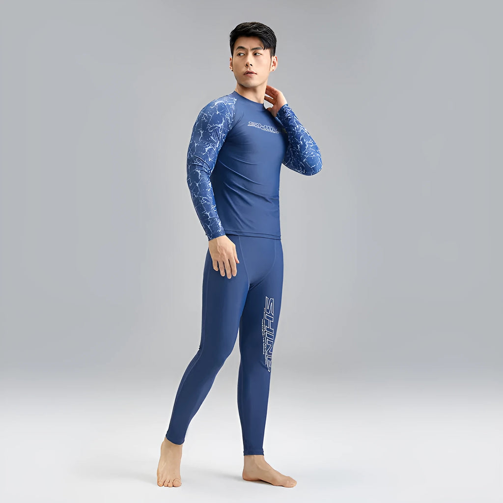 Men's dark blue patterned swim vest and matching swim trunks set on a white background.