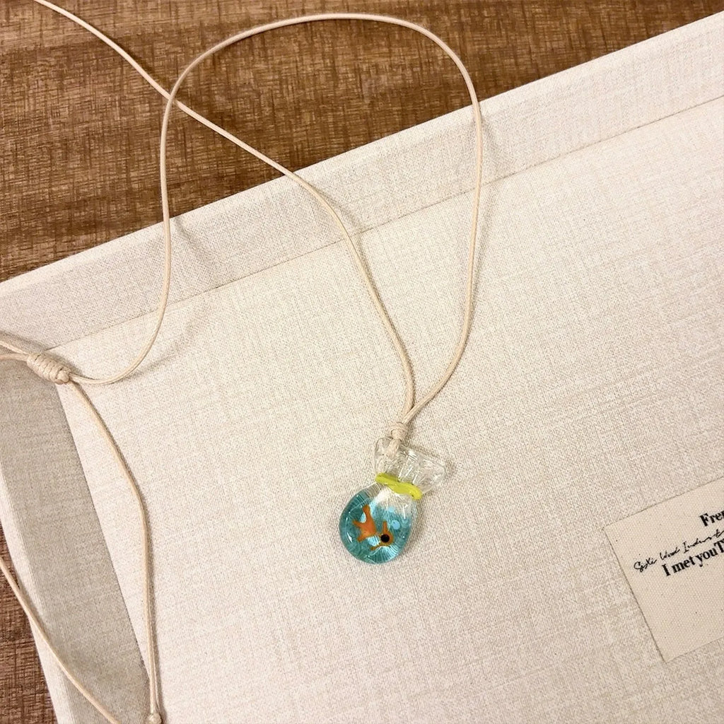 Women's skirt-shaped joker pendant necklace on a cotton and linen clavicle chain.