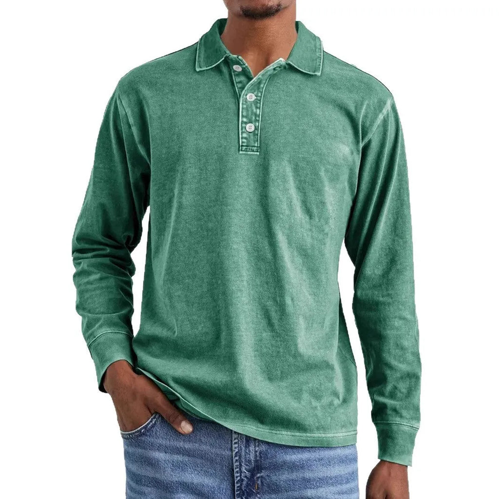 Man wearing a retro washed grey cotton polo shirt with distressed details and a lapel collar.
