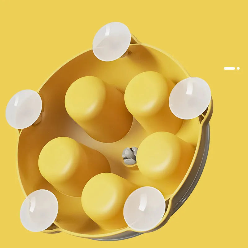 Yellow plastic interactive cat puzzle feeder toy with compartments for treats