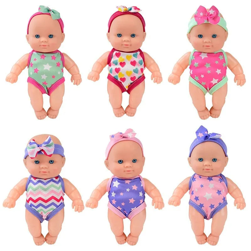 A detailed vinyl simulation baby figurine doll, showing its realistic features and proportions.