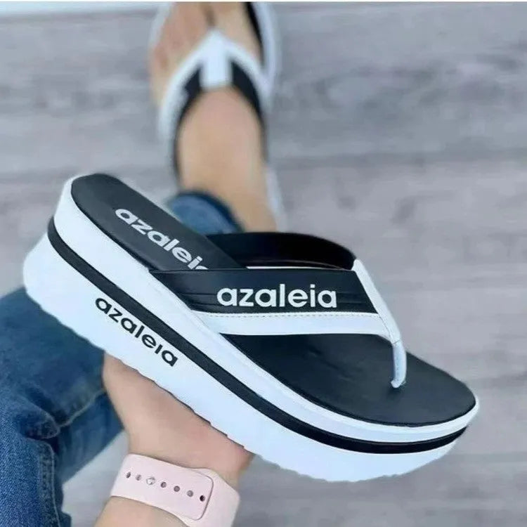 Women's light green PU platform slippers with a herringbone toe strap on a white background.