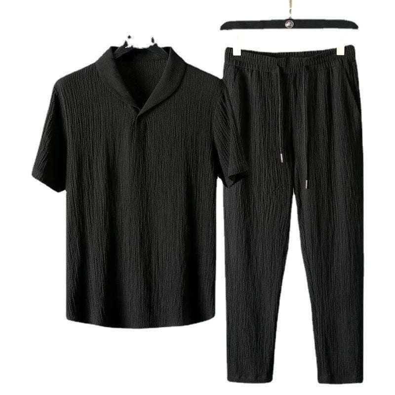 A stylish sports suit with ice silk short sleeves, made of premium polyester fiber in white and black colors.