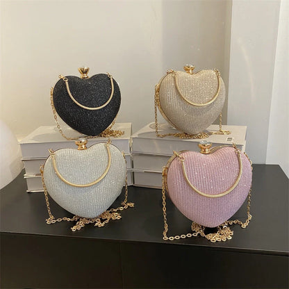 Heart-shaped shiny metal clutch bag with chain strap in various colours