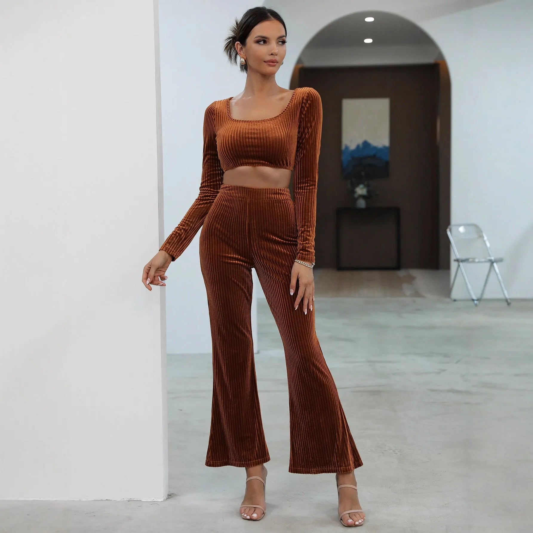 Caramel coloured long sleeve sweater and trouser casual set laid flat