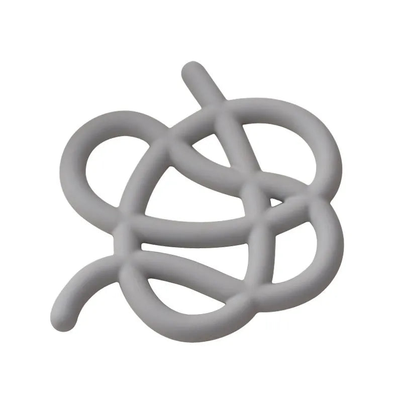 Ceramic heat proof mat in an irregular shape on a kitchen table, shown in a solid colour.