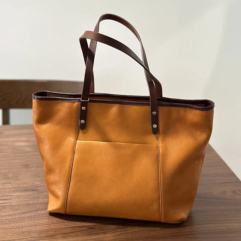 Horizontal square first-layer cowhide leather single-shoulder bag in brown with sewing thread detail and multiple pockets