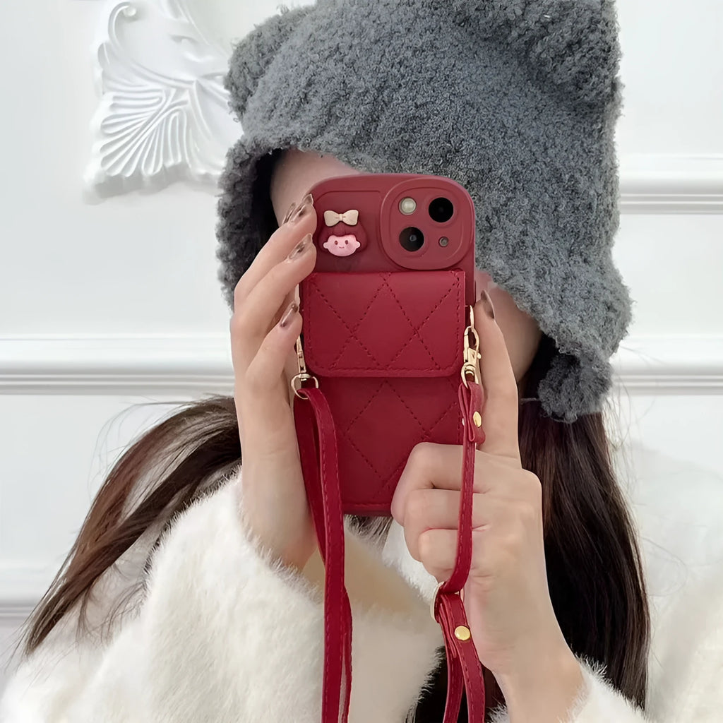 Red TPU crossbody card holder with lanyard for iPhone 15 showing diamond plaid pattern and rear card slot