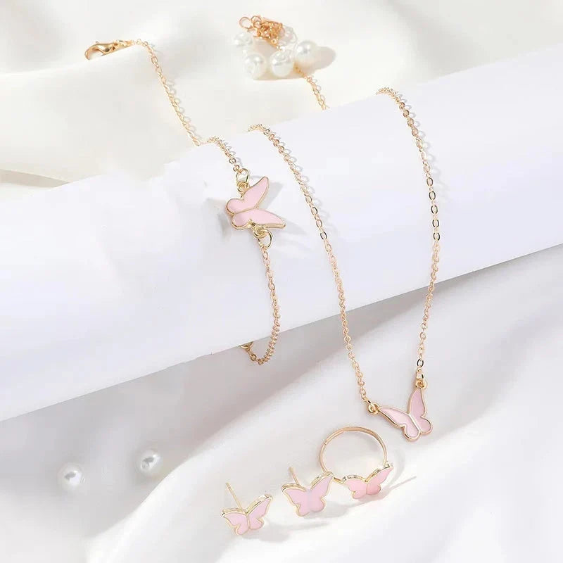 5-piece butterfly pendant jewellery set for women, including necklace, earrings, ring, and bracelet in various colours