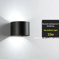 Modern black aluminium and glass wall lamp with silicone rubber detailing and integrated LED light.
