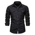 Men's slim-fit long-sleeved denim shirt in a solid colour on a hanger.