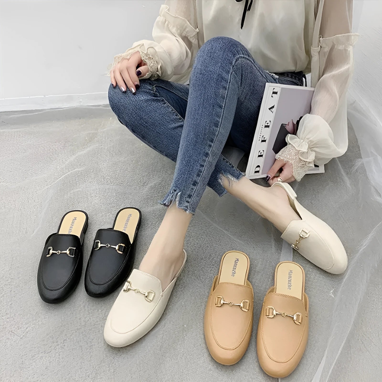 Women's PVC closed toe half slippers shown in milky white colour with a double buckle fastener.