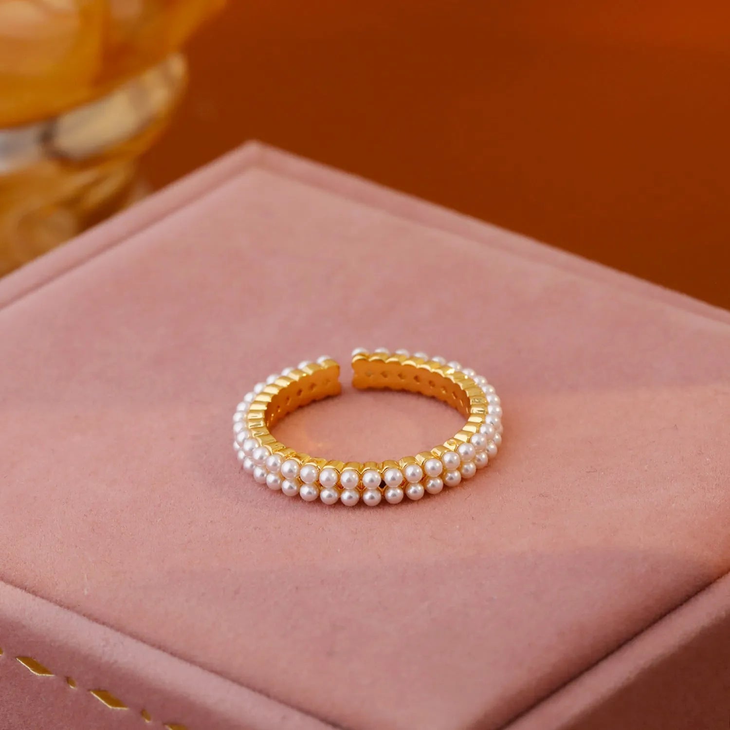 Gold geometric women's ring with open mouth design and round pearl element