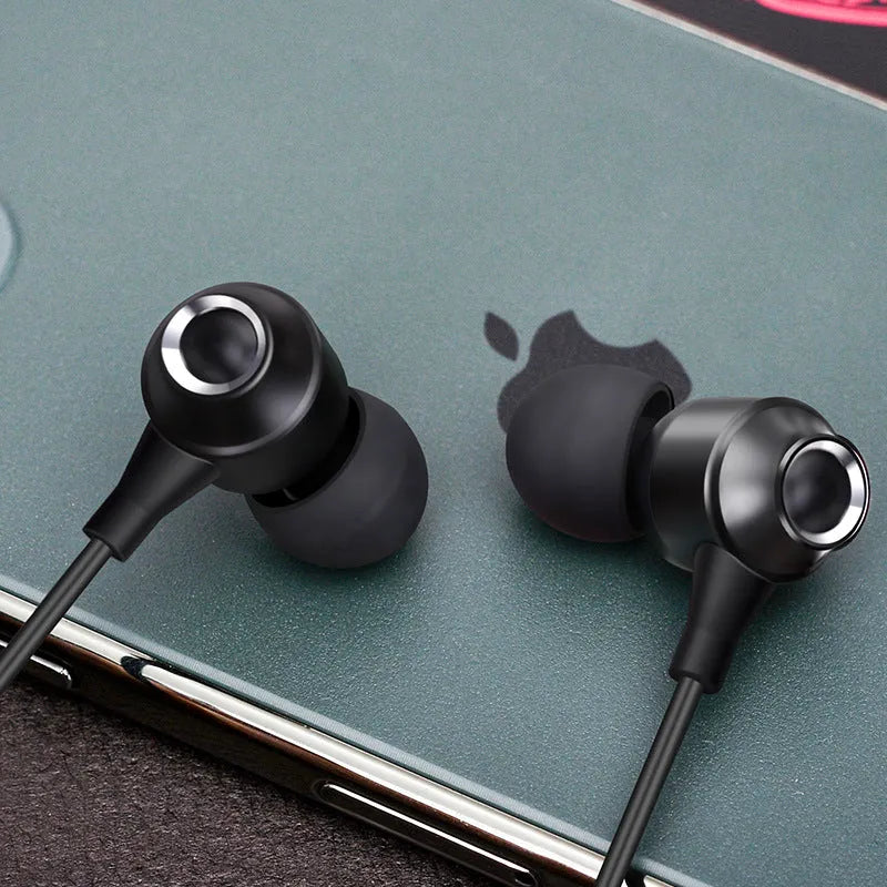 Wired in-ear headphones with silicone earplugs, 3.5mm plug and built-in microphone on a white background