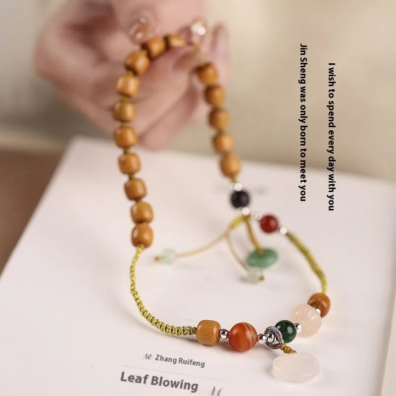 Hand-woven ebony wood bracelet with gemstone elements in double ring national style design