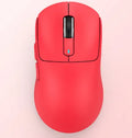 Black three-mode rechargeable computer mouse with USB receiver and coiled parachute cord on a wood desk.