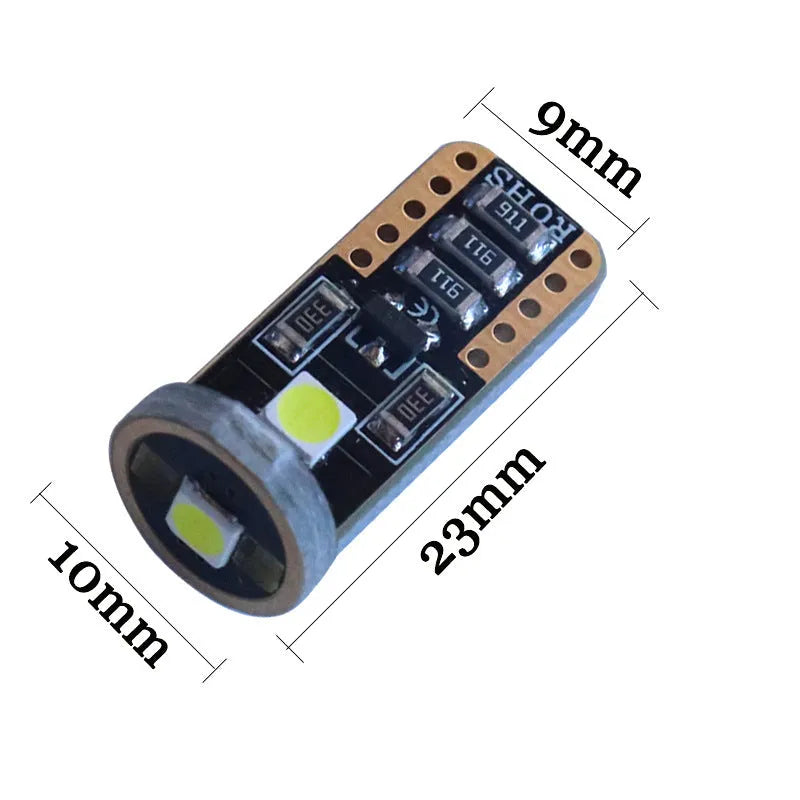 Single T10 W5W LED car interior light bulb with bright white LEDs on a dark board.