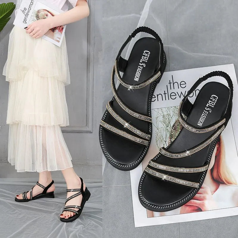 Korean style women's flat sandals in silver with rhinestone detail and elastic band.