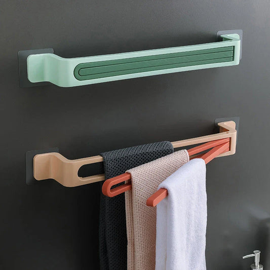 Rotating towel rack in various colors, featuring folding arms and a space-saving design for easy bathroom storage