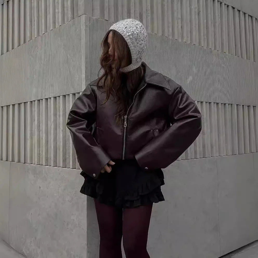 Stylish women's leather jacket with zipper detail in burgundy and black