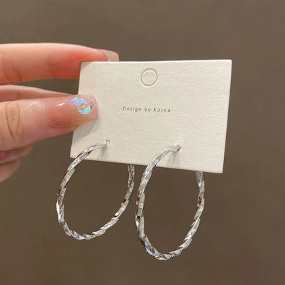 Geometric alloy earrings in gold and silver finishes