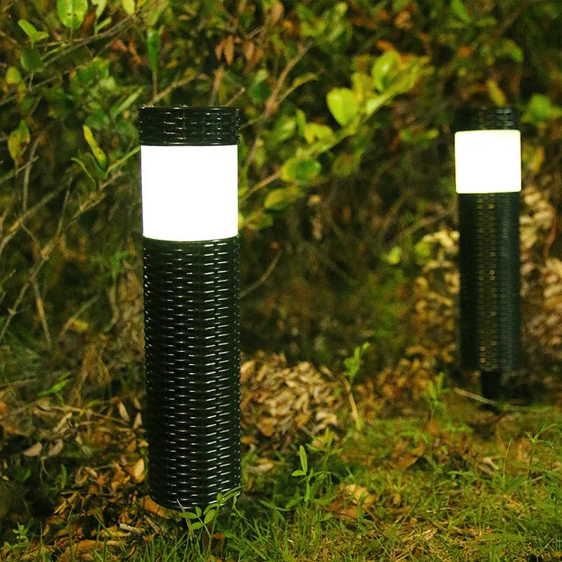 Solar-powered outdoor decorative garden light with abstract design and simulated flame effect