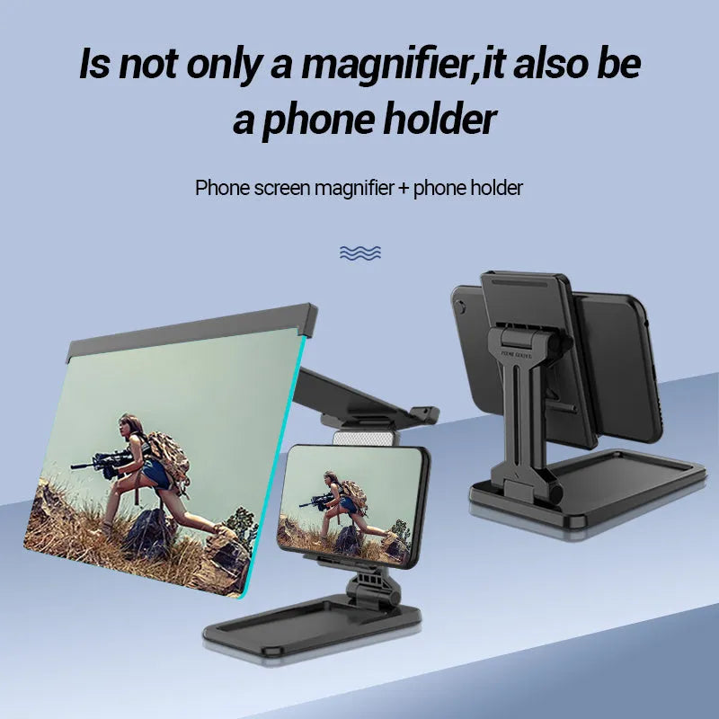 Black folding mobile phone screen magnifier and detachable holder on a desktop.