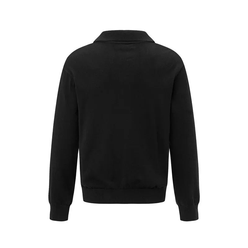 Loose-fitting pullover sweater in black, dark grey, and creamy-white colours