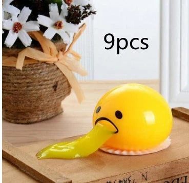 Gudetama Vomiting Egg Toy in green, orange, pink, and yellow