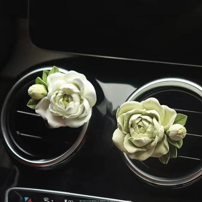 Gypsum solid car air freshener with jasmine oil clipped to vehicle vent