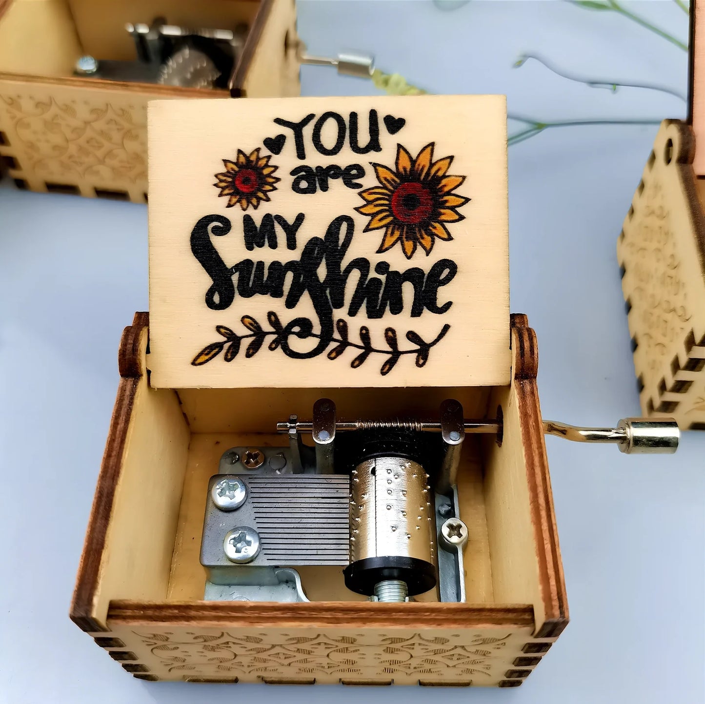 Antique boxwood music box with hand crank and yin carved Spirited Away landscape flowers, 10 cm tall wooden decoration