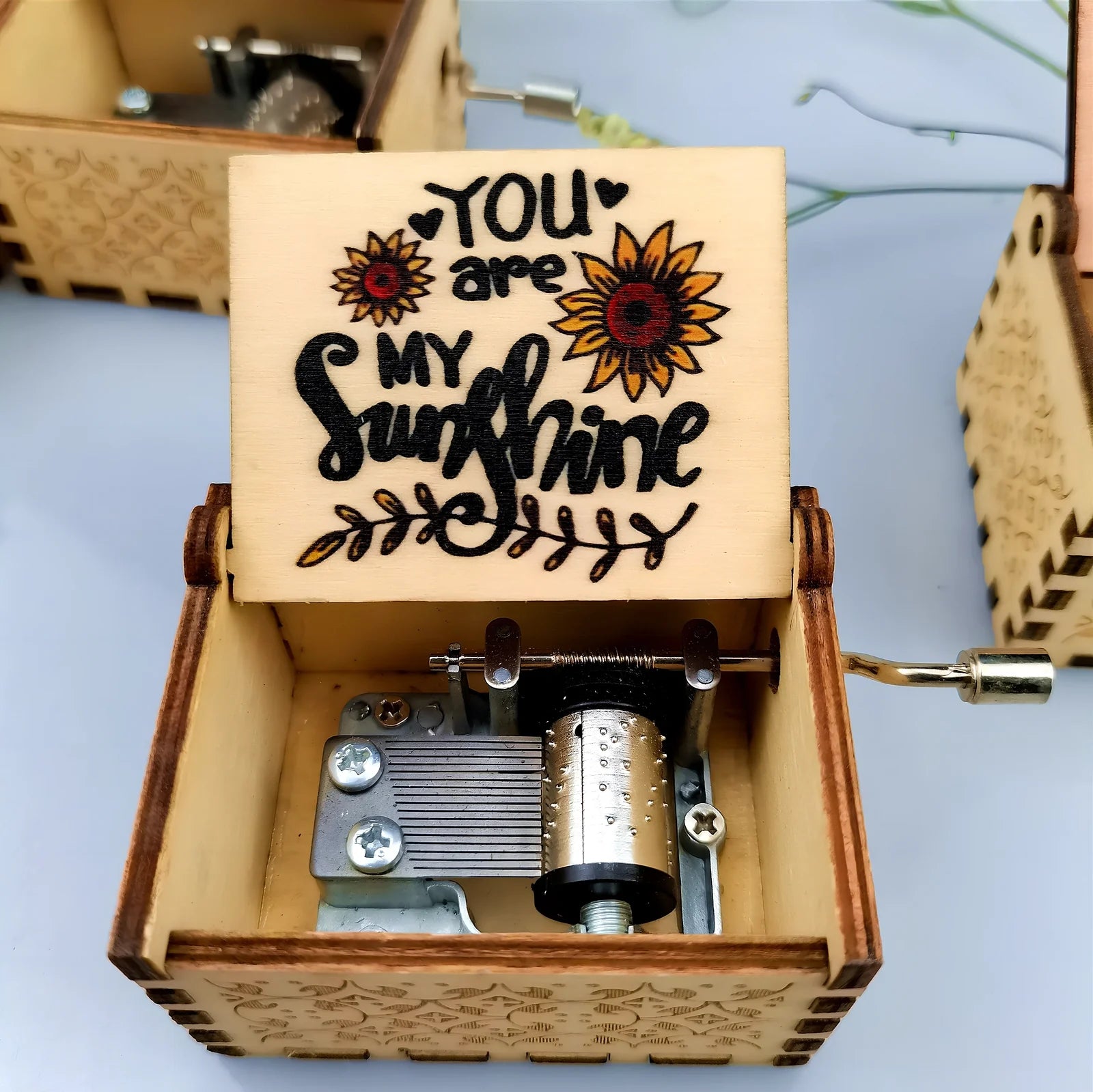 Antique boxwood music box with hand crank and yin carved Spirited Away landscape flowers, 10 cm tall wooden decoration