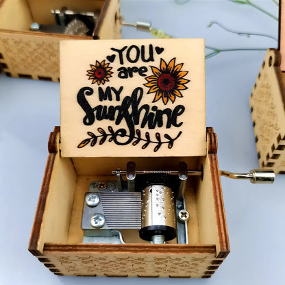 Antique boxwood music box with hand crank and yin carved Spirited Away landscape flowers, 10 cm tall wooden decoration