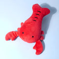Red lobster stuffed dog toy with flapping tentacles on white background