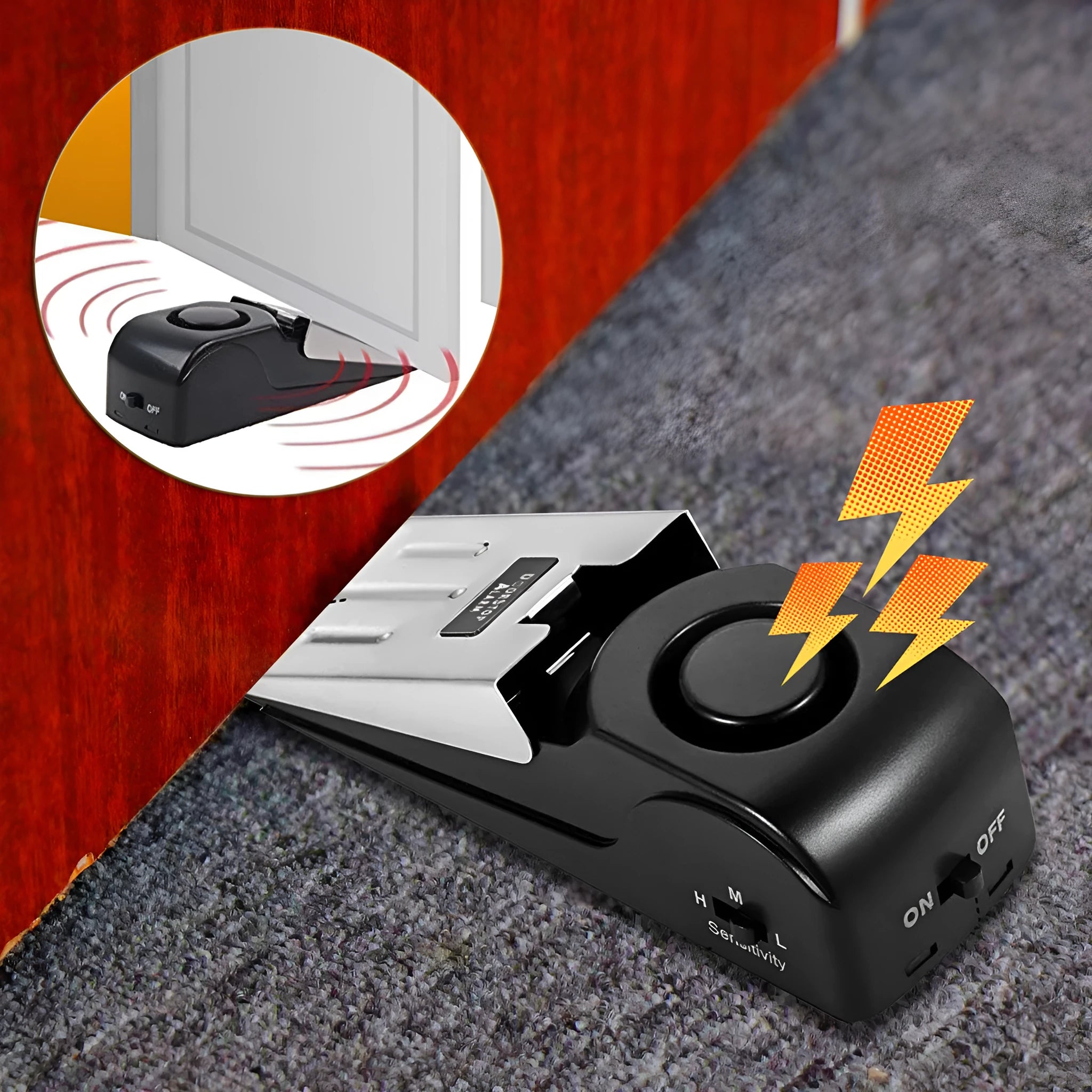 Black wedge-shaped door alarm with stainless steel cover and sensitivity controls