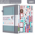 No date journal notebook with elastic strap closure in purple, showing thread binding and thick paper.