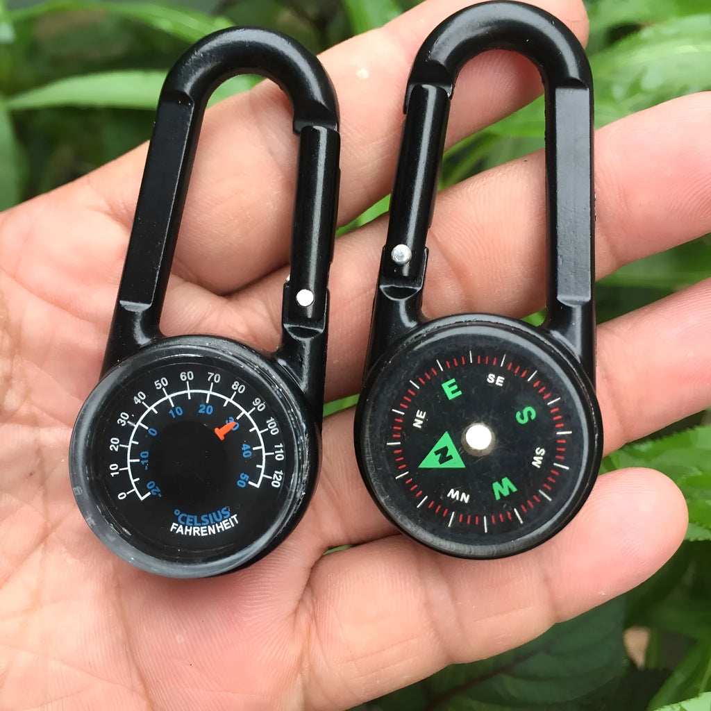 Black zinc alloy double-sided button carabiner with visible thermometer and compass gauge.