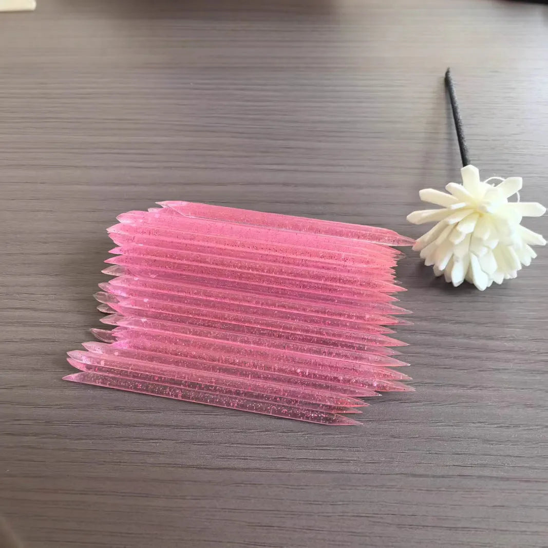 Nail glue sticks 100pcs in assorted colours including pink, blue, green, and purple, 7.5cm and 9.3cm lengths