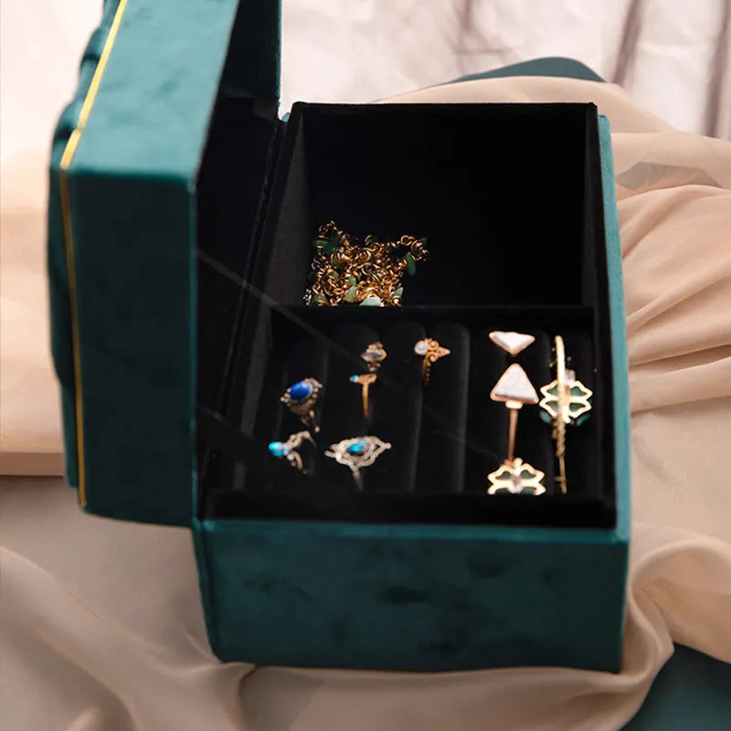 Blue plastic jewellery box with gold flannel interior for desktop storage