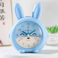 Cartoon style children's singing alarm clock with mute function, 6.5cm thick, in pink or blue
