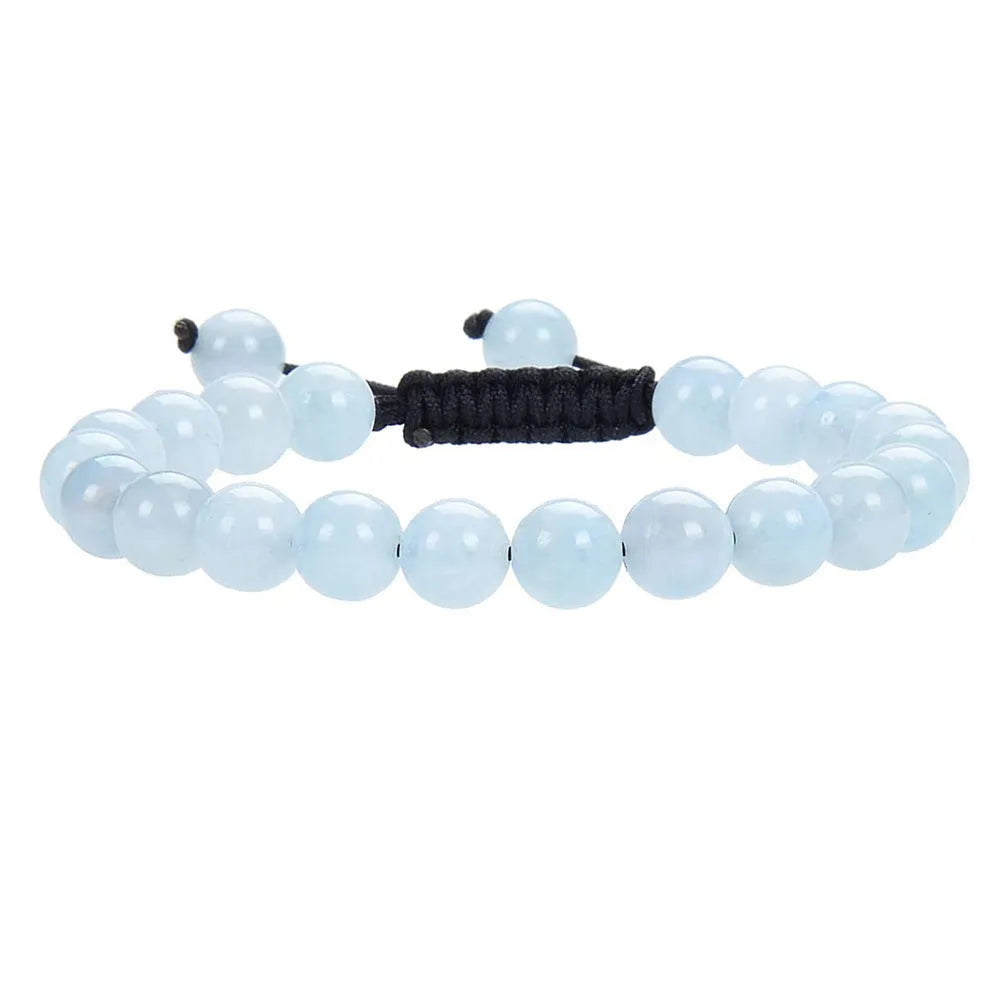 Women's flat knot braided bracelet in aquamarine with geometric woven patterns.