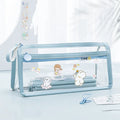 Transparent double-layer pencil case showing two compartments, available in multiple colours