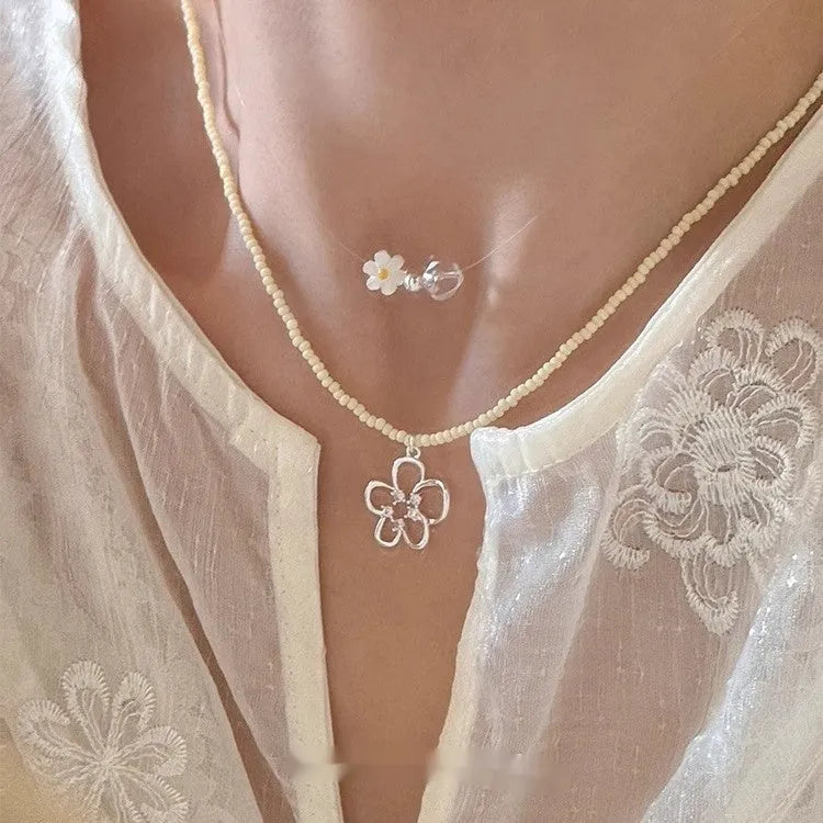 Women's U-shaped copper necklace with hollow flower pendant and colourful beaded decoration