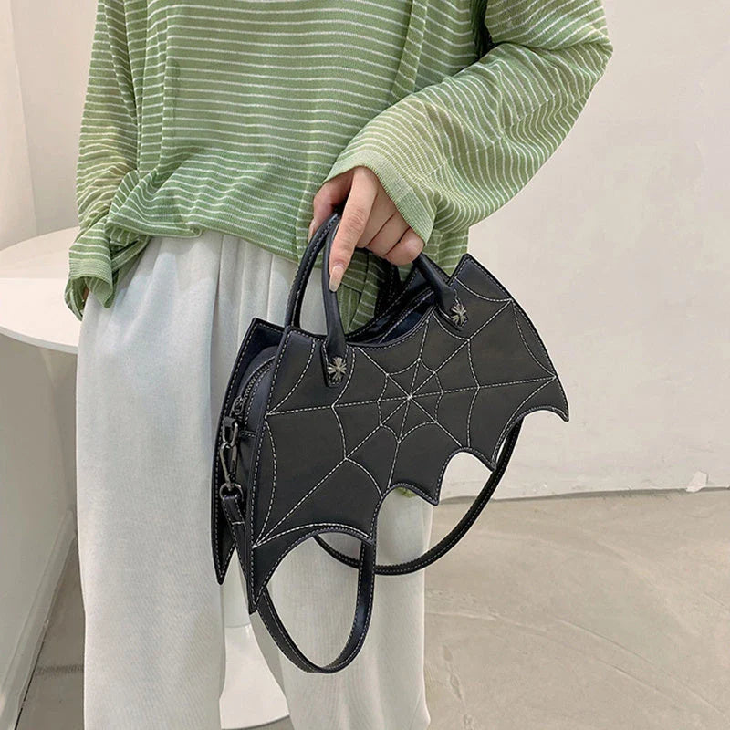 A stylish PU leather shoulder bag with a unique spider web and Batgirl-inspired design, available in a variety of vibrant colors.