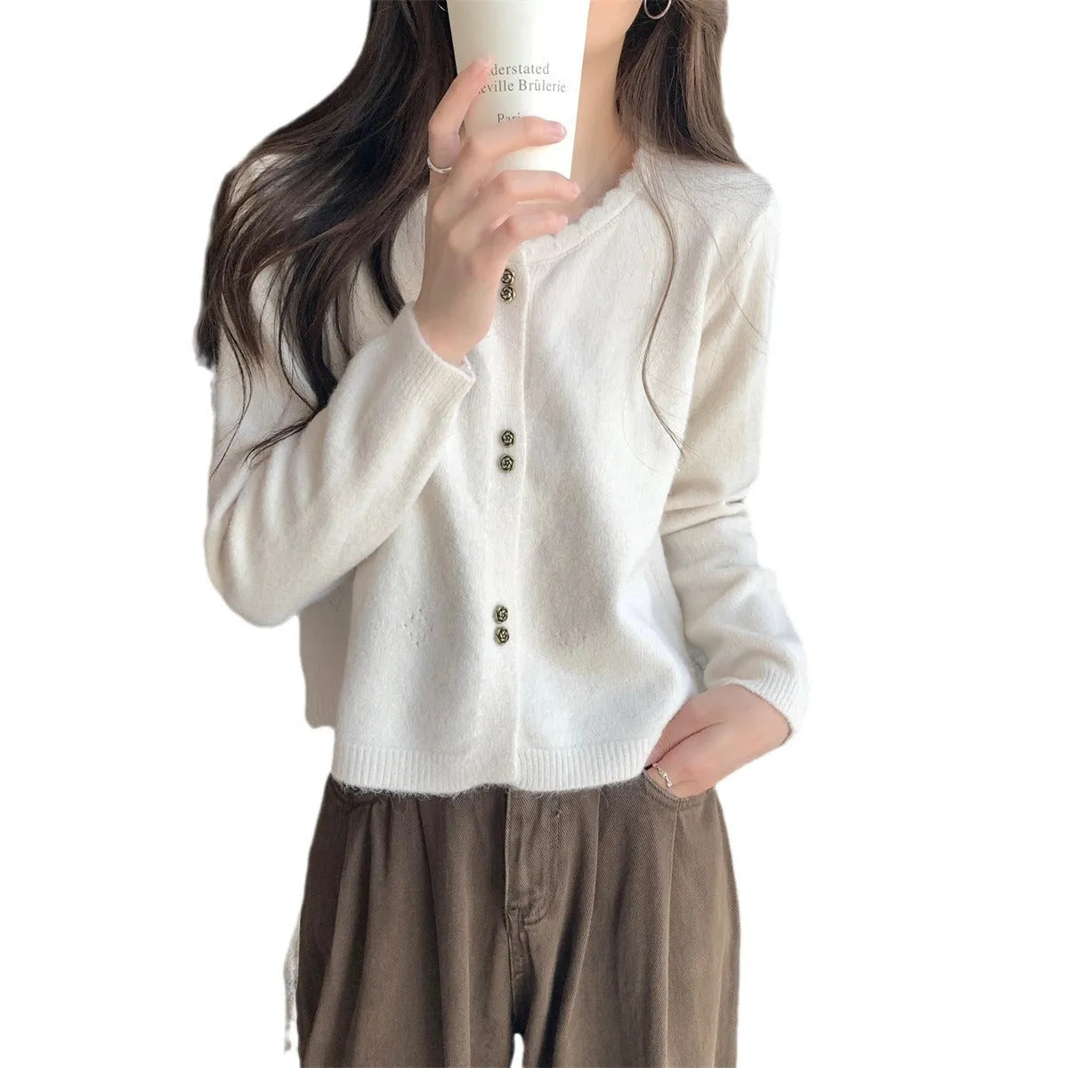 Women's long-sleeved acrylic cardigan coat in milky white, available in four other colours.
